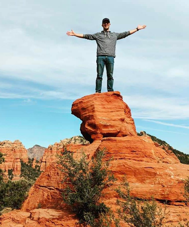 Matt Herron standing on a rock formation in Sedona, Arizona